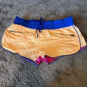 Lorna Jane athletic short. Size small. Color block orange/pink w blue accent